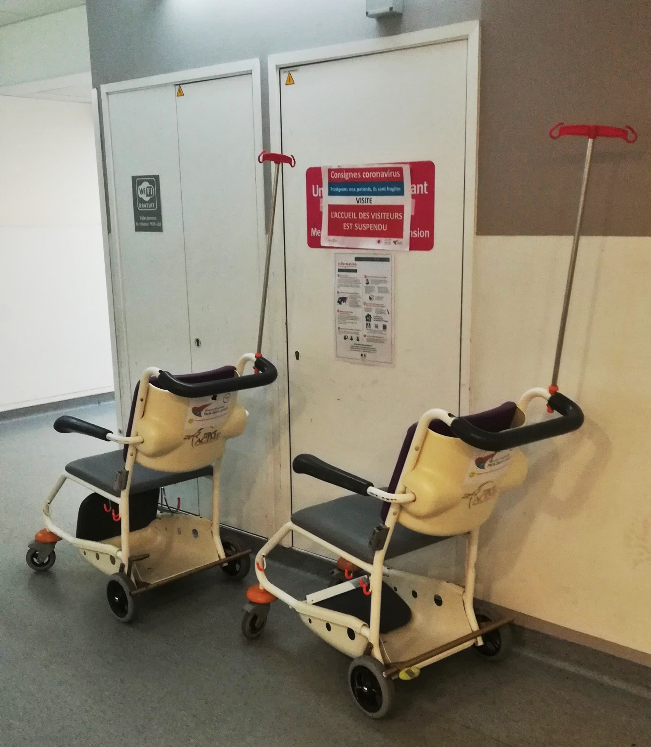 A wheelchair in a care facility corridor