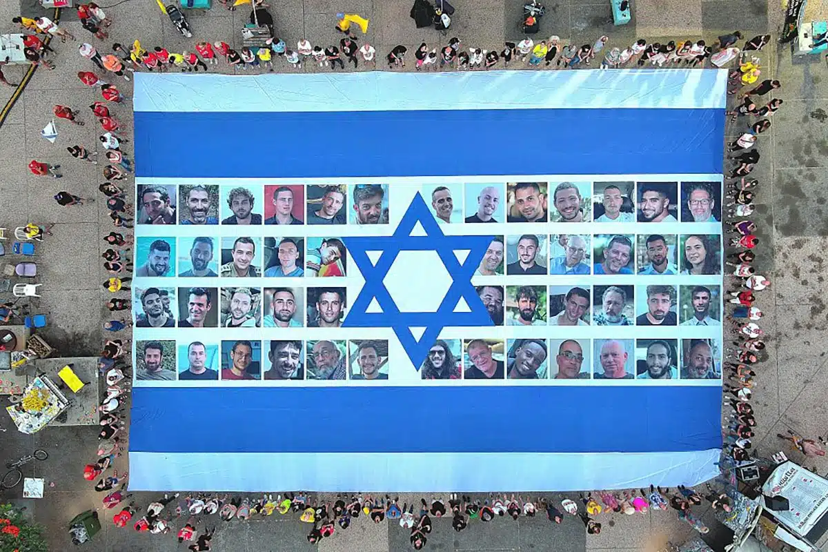 A giant Israeli flag made up of portraits of the October 7 victims