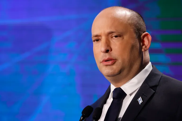 Naftali Bennett speaks at a political event